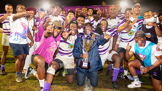 Rhodes bckapp_bck-άƽ̨ Vice-Chancellor, Professor Sizwe Mabizela, celebrates with the rugby team after the final whistle. Photo cred: Vusumzi Tshekema.